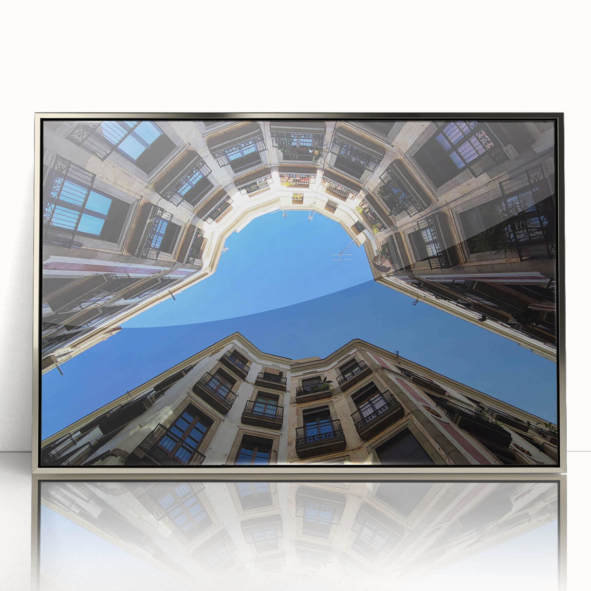 Large art print of Barcelona scenery in muted colors on a silver-framed acrylic, ideal for modern art wall decor.