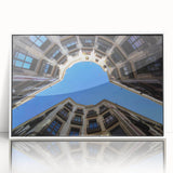 Framed acrylic print of a mid-century modernist Barcelona cityscape in muted gray and blue tones, ideal for nursery wall art.