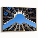 Framed canvas depicting a vintage-style Barcelona landscape in muted gold and black tones, ideal for bedroom wall art.