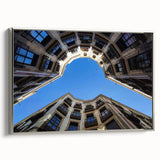 Landscape art painting of Barcelona with colorful vintage poster art style, framed in silver on canvas.