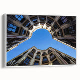 Vintage poster art of Barcelona with colorful accents on a large framed canvas, ideal for living room decor.