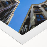 Art deco poster of Barcelona skyline in muted earth tones on rolled canvas, suitable for dining room decor.