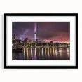 Abstract art print of Auckland skyline in vibrant colors on a textured, extra large canvas, framed in black.