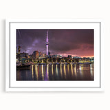 Abstract art print of Auckland skyline in muted blue and gray tones on a white framed canvas, suitable for dining room decor.