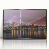 Mid-century modernist art depicting the Auckland skyline in muted blue and gold tones on a framed acrylic print.