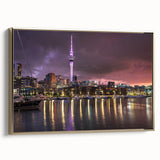 Framed canvas depicting a vintage-style landscape of Auckland, New Zealand in muted gold and black tones.