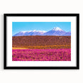 Extra large abstract art print depicting a colorful, textured scenery of Bolivia, in a black frame with mat.