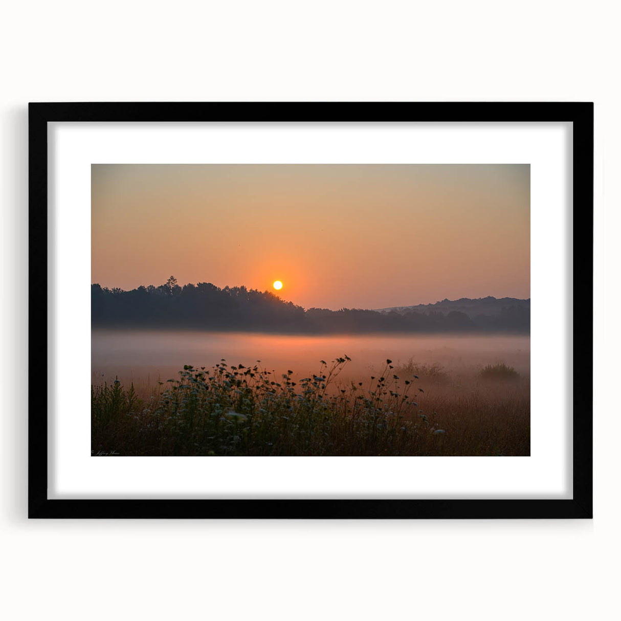 Abstract art print depicting vibrant, colorful scenery of Connecticut, framed in black, suited for living room decor.