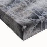 Large art featuring a black and white landscape painting of Idaho scenery on stretched canvas.