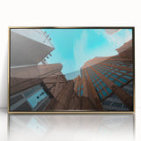 Large art print of Charlotte, North Carolina skyline in gold and blue tones on framed acrylic.