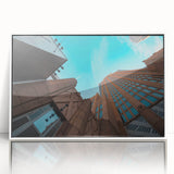 Acrylic print of Charlotte, North Carolina skyline in muted colors, framed in white, suitable for modern art wall decor.