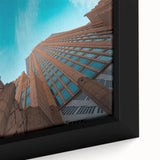 Extra large framed canvas of Charlotte skyline in textured black with colorful accents, ideal for living room decor.