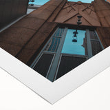 Art deco poster of Charlotte skyline in muted blue and gray tones on rolled canvas, suitable for dining room décor.