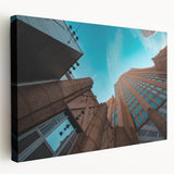 Large art depicting the Charlotte, North Carolina skyline in muted blue and gray tones on stretched canvas.
