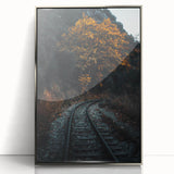 Mid-century modernist art depicting an autumnal forest in muted orange and brown tones, framed in silver acrylic.