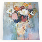 Abstract floral artwork on stretched canvas, featuring vibrant colors and intricate patterns, elegantly leaning against a wall, perfect for modern home decor.