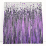 Abstract floral canvas art showcasing vibrant colors and intricate designs, leaning against a neutral wall, ideal for modern home decor and artistic inspiration.