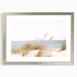 Textured abstract art print in muted blues and grays on a framed canvas, ideal for bedroom ambiance.