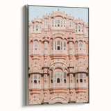 Framed canvas artwork depicting a serene landscape with a majestic castle, set in a silver frame. The piece features vibrant colors and intricate details, perfect for enhancing home decor.