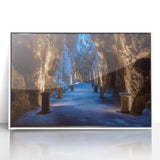 Framed acrylic artwork showcasing a stunning landscape with caves, featuring vibrant colors and intricate details, set against a sleek white frame for modern decor.