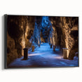 Framed canvas artwork showcasing a stunning landscape with intricate cave formations, set against a black backdrop, ideal for modern home decor and art enthusiasts.