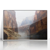 Framed acrylic artwork showcasing a serene landscape of canyons with vibrant colors, perfect for home decor. White frame enhances the visual appeal.