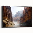 Framed canvas art showcasing a stunning landscape of canyons in rich earthy tones, set in a sleek black frame, perfect for enhancing home decor. Ideal for nature lovers and art enthusiasts looking to add depth to their living spaces.