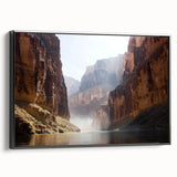 Framed canvas art showcasing a stunning landscape of canyons in rich earthy tones, set in a sleek black frame, perfect for enhancing home decor. Ideal for nature lovers and art enthusiasts looking to add depth to their living spaces.
