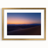 Framed desert landscape artwork with a gold mat, showcasing vibrant colors and intricate details, perfect for home decor or office settings, enhancing aesthetic appeal.
