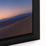 Close-up of a framed canvas artwork showcasing a vibrant desert landscape design, featuring warm tones of orange and yellow, perfect for home decor enhancement.