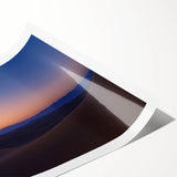 Desert landscape rolled canvas print showcasing vibrant hues of orange and yellow, depicting a serene sunset over a sandy dune, perfect for home decor.