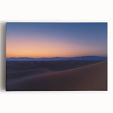 Stretched canvas artwork showcasing a vibrant desert landscape with warm tones of orange and yellow, designed to enhance interior decor and evoke tranquility.