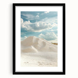 Framed landscape art print showcasing serene sand dunes in soft beige and golden hues, featuring a sleek black frame with a white mat for an elegant presentation.