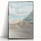 Framed acrylic artwork showcasing a serene desert landscape with rolling dunes, featuring a silver frame that enhances its modern aesthetic. Ideal for home decor.