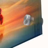 Close-up of a vibrant acrylic glass artwork depicting serene landscapes with lush green fields and a vivid blue sky, showcasing intricate details and colors.