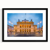 Abstract art print depicting a vibrant, textured European scenery in a black frame, ideal for living room decor.