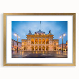 Abstract art print of a European landscape in muted earth tones on a gold-framed canvas, suitable for dining room decor.