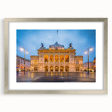 Extra large abstract art print of a textured European scenery in muted earth tones, framed in silver.