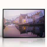 Large abstract wall art depicting a European cityscape in muted gray and blue tones on a framed acrylic.