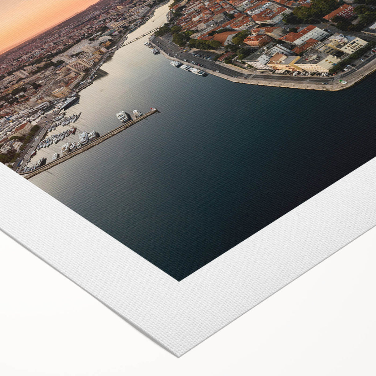 Art Deco poster of a Croatian coastal town in muted blue and white tones on rolled canvas, suitable for dining room decor.