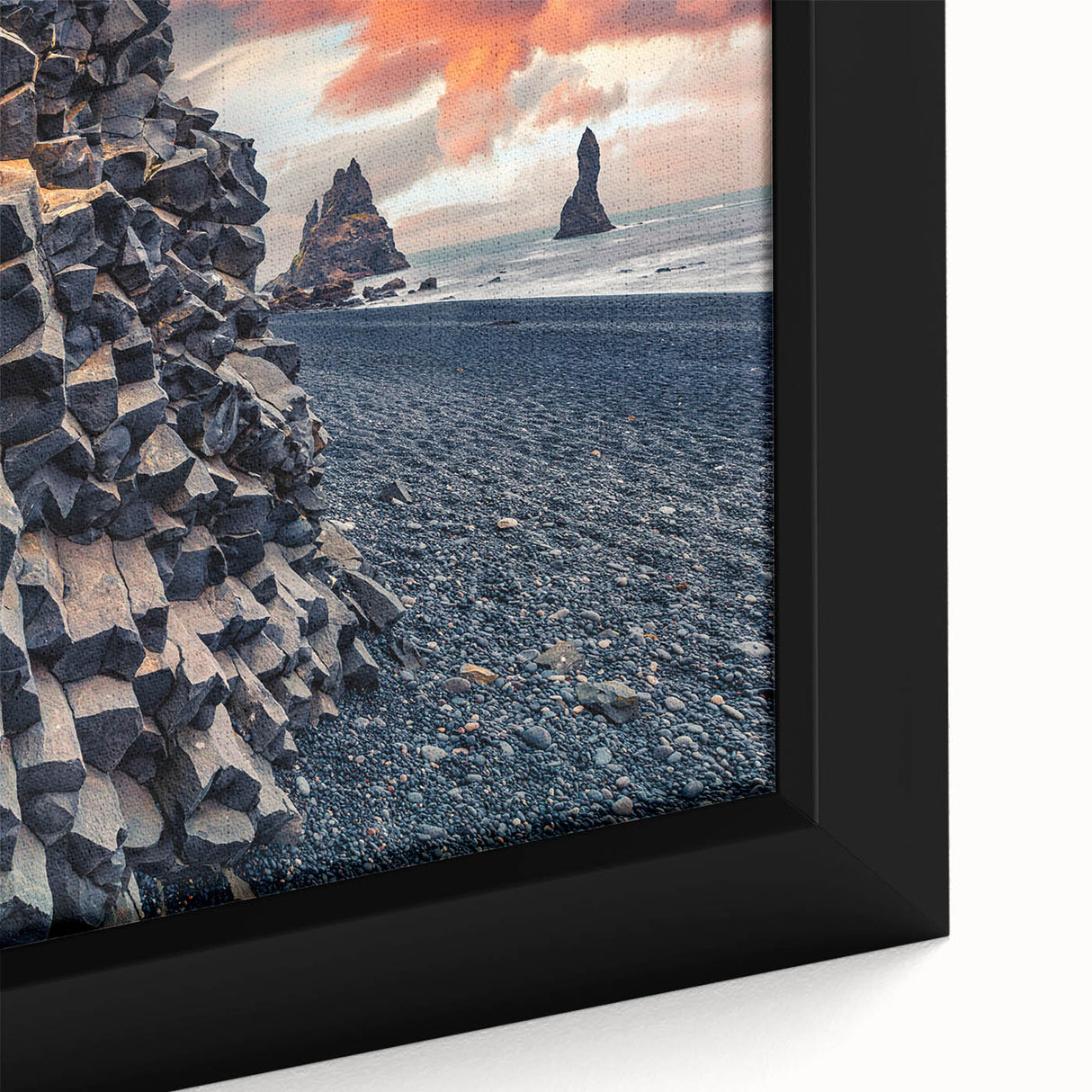 Framed canvas featuring a textured Icelandic landscape in muted grays with vibrant color accents.