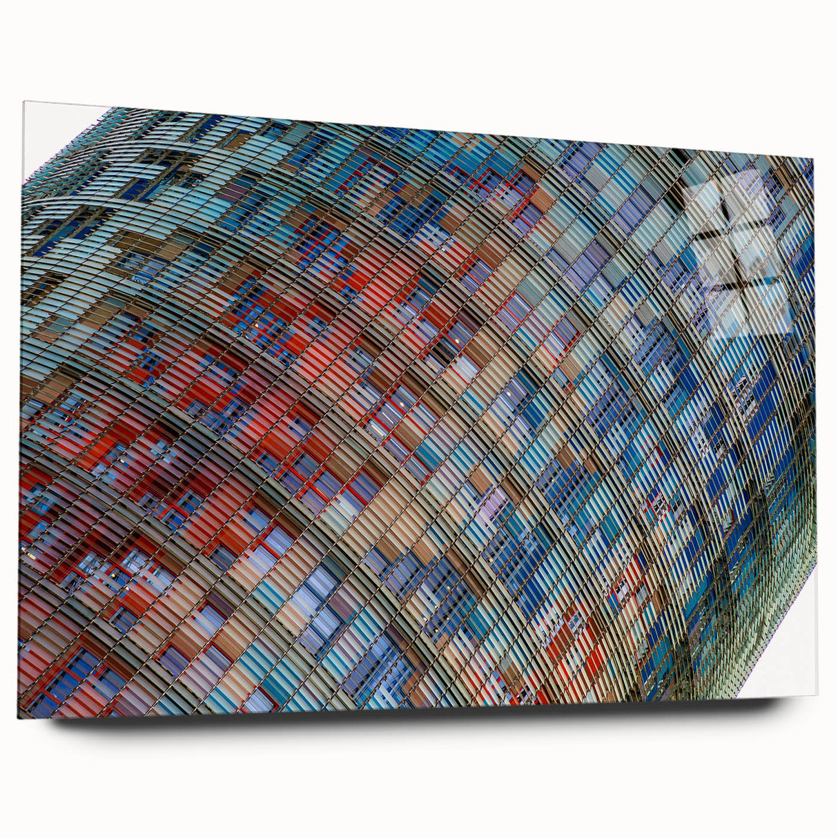 Large abstract depiction of Barcelona skyline in muted blue and gray on acrylic glass.