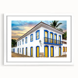 Abstract art print of a stylized Brazilian landscape in vibrant colors on a white framed canvas.