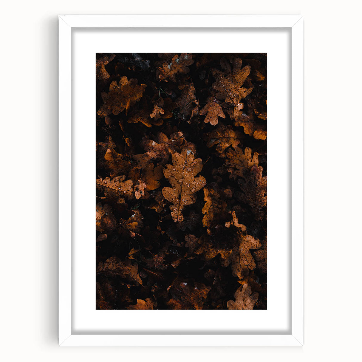 Abstract art print of autumnal trees in orange and red tones on a white framed canvas, suitable for dining room decor.