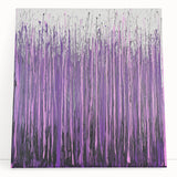 Abstract floral stretched canvas artwork featuring vibrant colors and intricate designs, elegantly leaning against a wall, perfect for modern home decor.