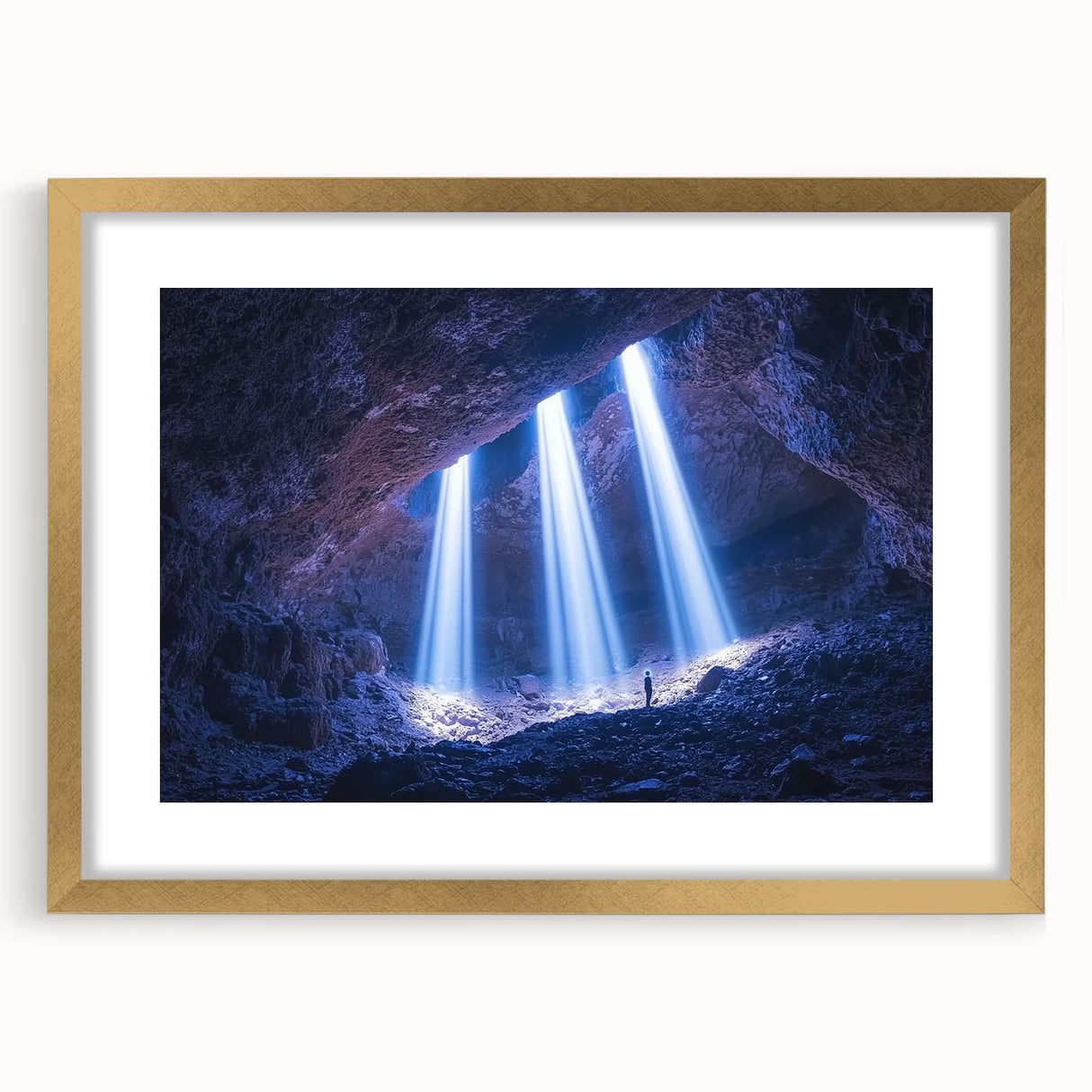 Framed landscape artwork featuring a cave scene with a gold mat, showcasing earthy tones and intricate details, perfect for home decor or art enthusiasts.