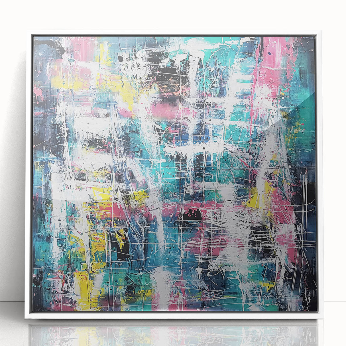 Framed abstract art piece featuring colorful splatters on a white background, showcasing vibrant hues and dynamic shapes, perfect for modern home decor.