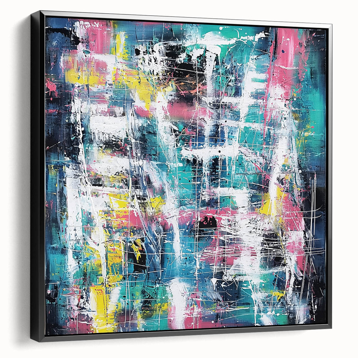Framed canvas art displaying abstract black splatter designs on a textured surface, showcasing a modern aesthetic perfect for contemporary home decor.