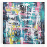 Abstract splatter design on stretched canvas showcasing vibrant colors of blue, pink, and yellow, perfect for modern home decor or art enthusiasts.