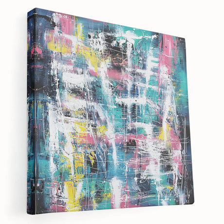 Abstract canvas art featuring vibrant splatter designs in shades of blue, orange, and yellow, displayed from a side view, perfect for modern home decor.